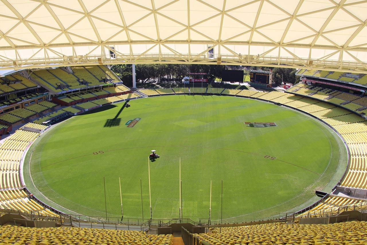 Adelaide Oval covered in yellow Peeball T-shirts